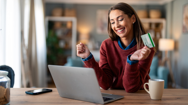 Woman online shopping with a credit card