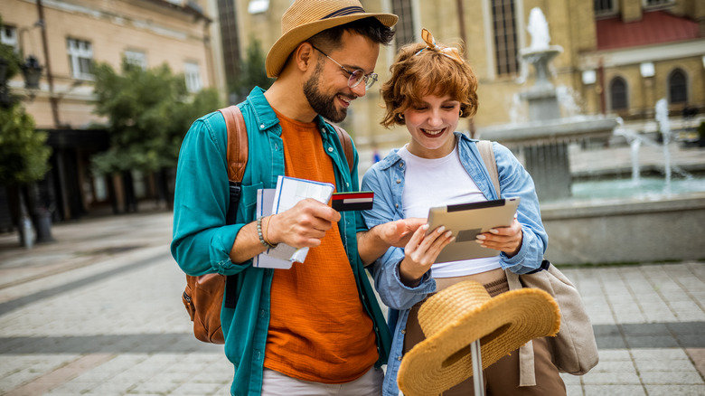 Couple traveling wth credit cards