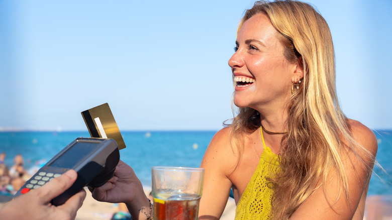 woman traveling with credit card