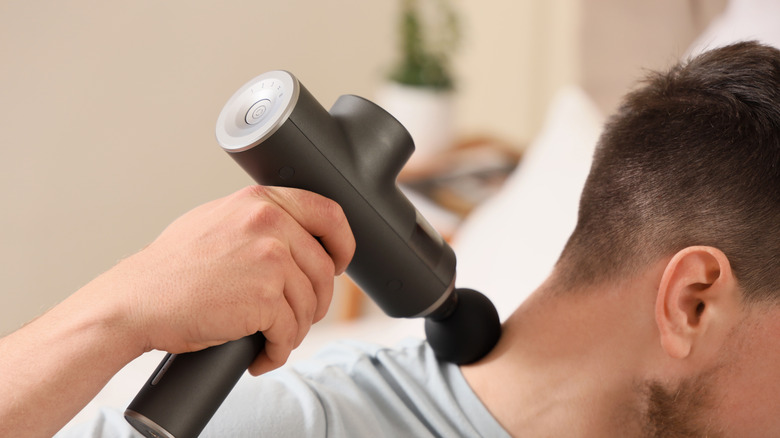 Man using neck massager