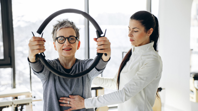 Woman using pilates ring