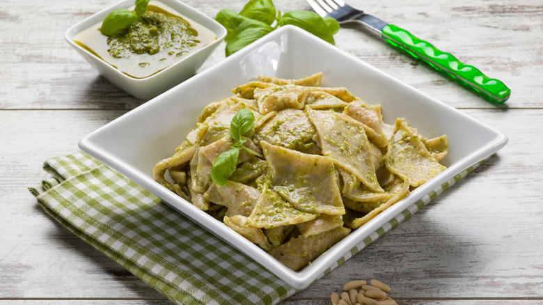 Traditional testaroli in a dish served with pesto
