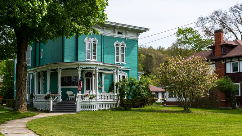 A teal-colored Victorian Mansion in Titusville, PA