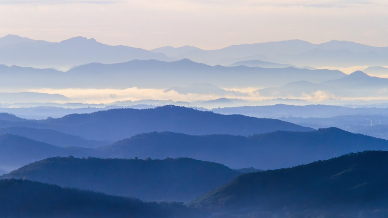 Layers of blue mountain ridges with fog in the Blue Ridge Mountains in North Carolina
