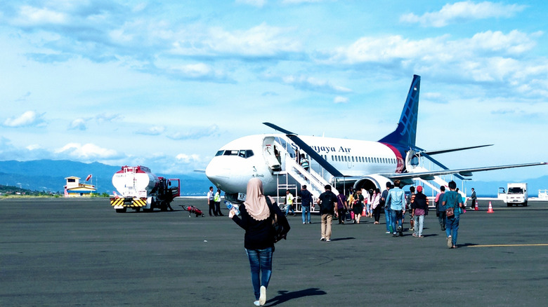 A passenger jet at Syukuran Aminuddin Amir Airport in Luwuk, Central Sulawesi