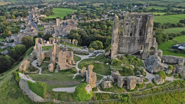 Aerial view of Corfe Castle in Dorset, England, and the surrounding countryside