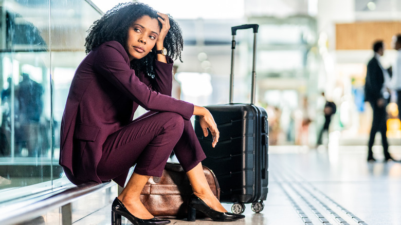 Unhappy woman in an airport