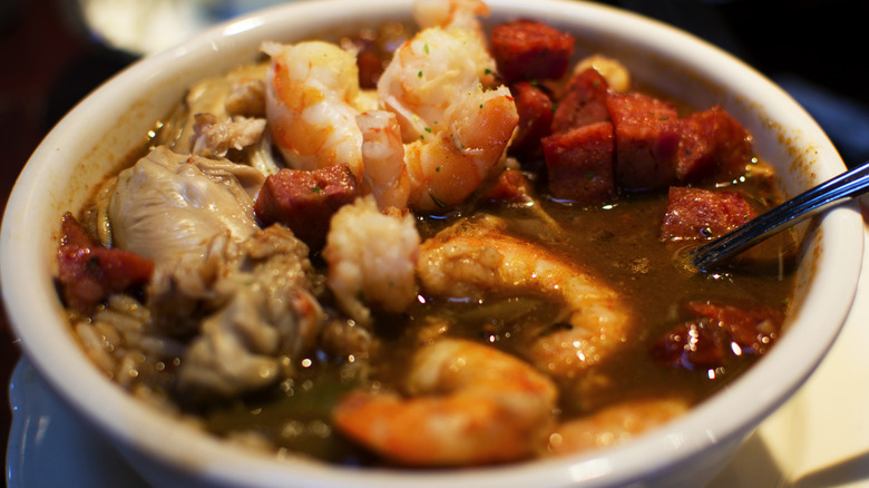 Bowl of seafood gumbo with boudin sausage