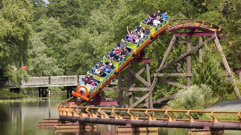 People riding roller coaster at Six Flags park