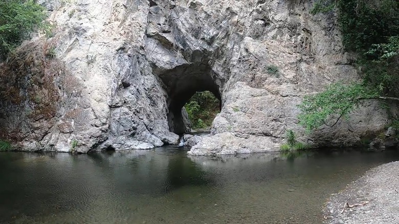 A hole in a rock ledge next to a swimming hole in Leggett, California