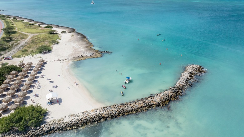Resort beach on Aruba with blue waters and white sand