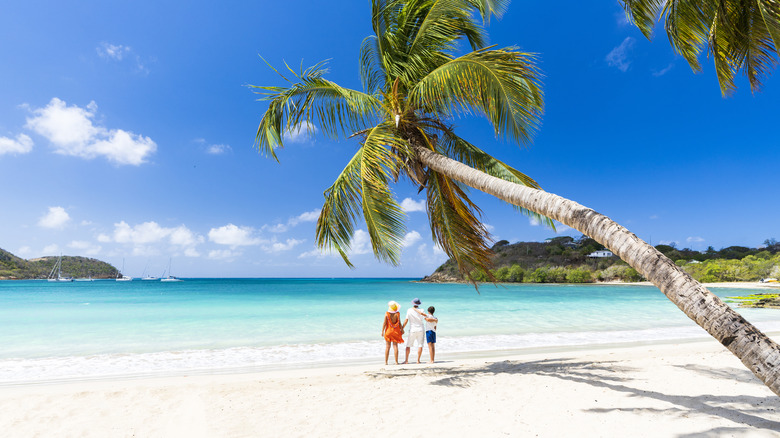 Family overlooking the Caribbean on the island of Antigua