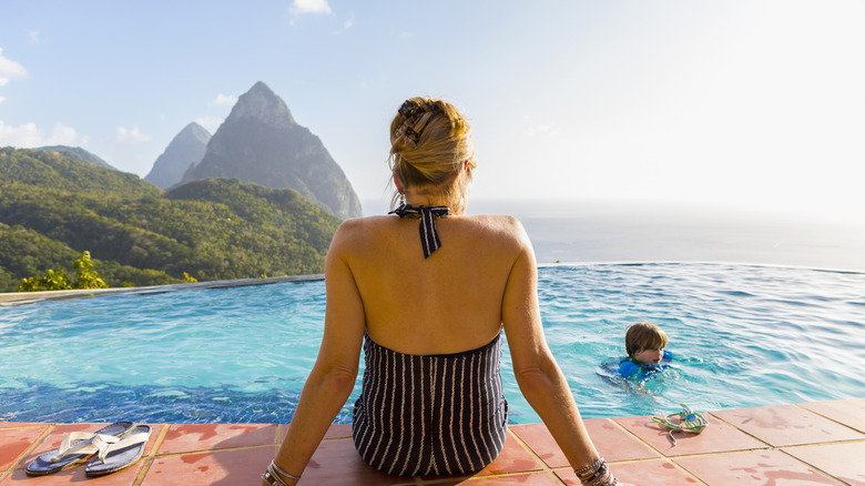 Woman lounges near pool