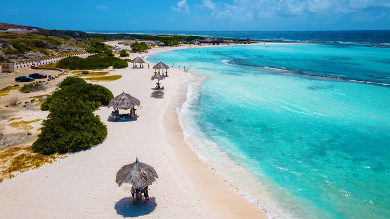 Huts line coast of Baby Beach, Aruba