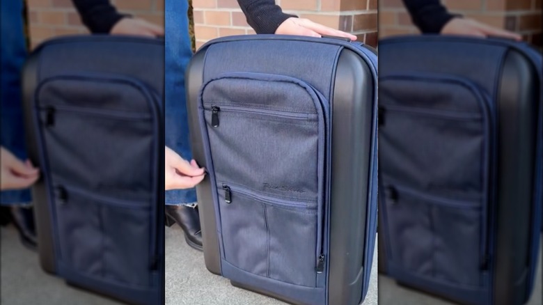 The Heather Navy Riga Rolling Case designed by Rick Steves