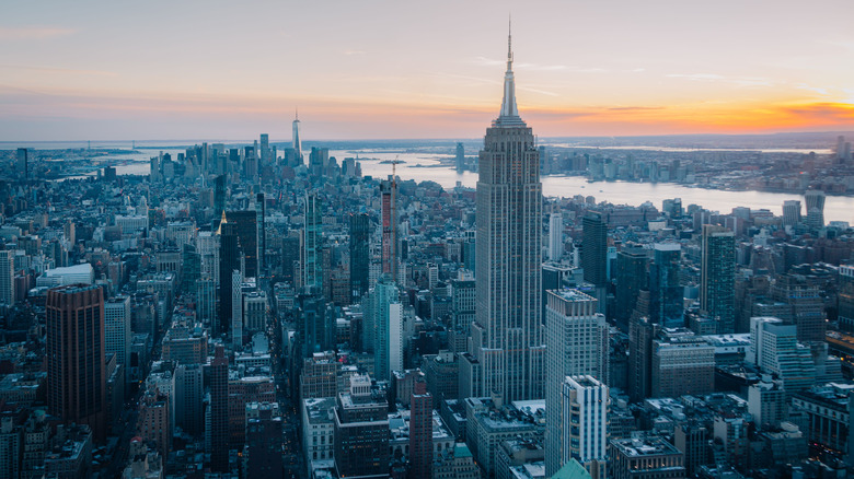 Aerial view as sun sets over New York City skyline
