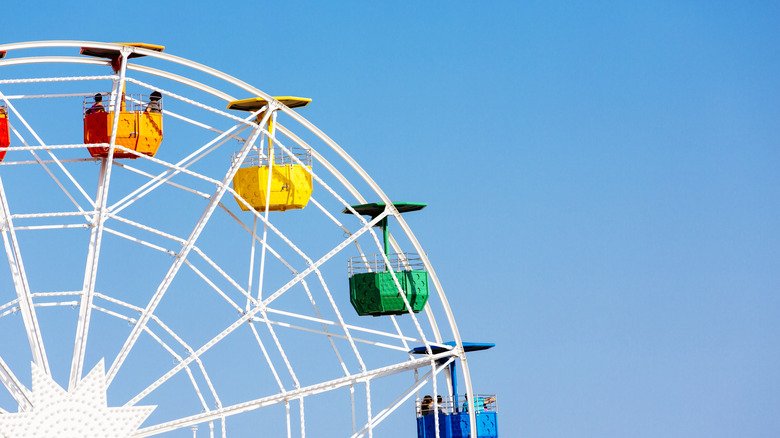 People riding ferris wheel