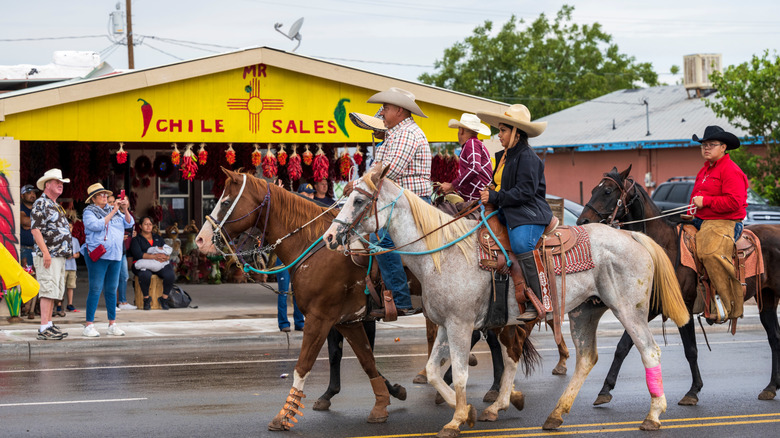 Horseback riders parading through Hatch during the Chile Festival