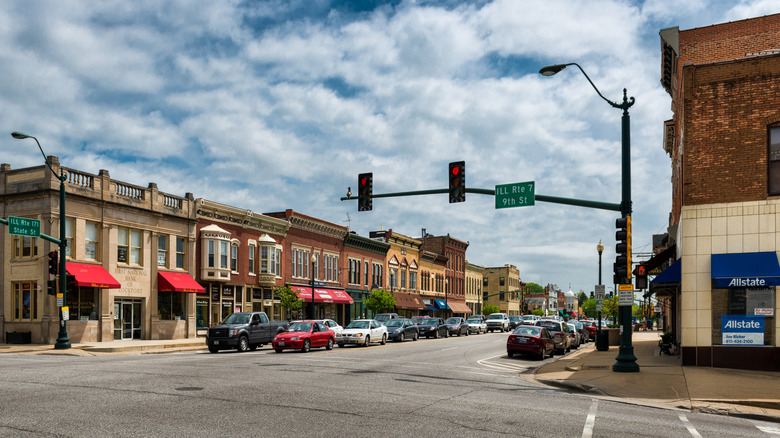 Lockport street with store awnings and parked cars