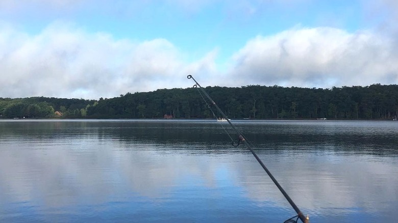 A fishing rod extended over the clean waters of Black Oak Lake in Wisconsin