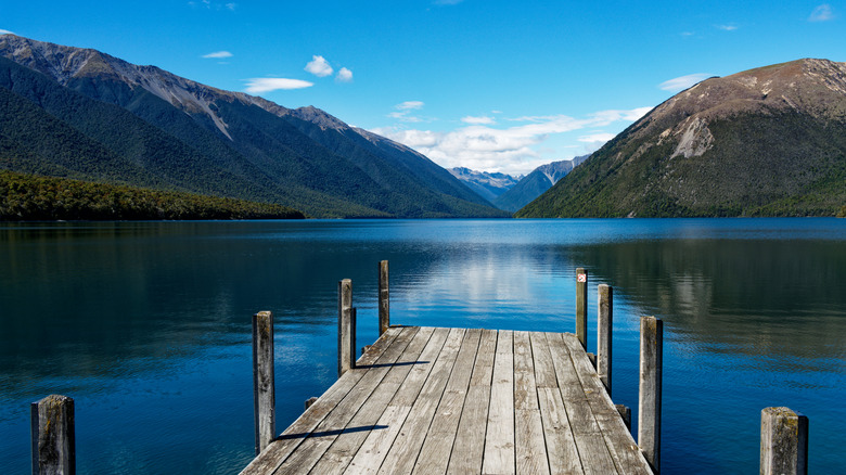 Pier at Lake Rotoiti in Nelson Lakes National Park with mountains in background