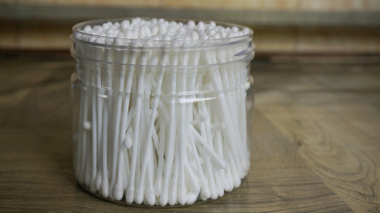 Jar of white cotton swabs