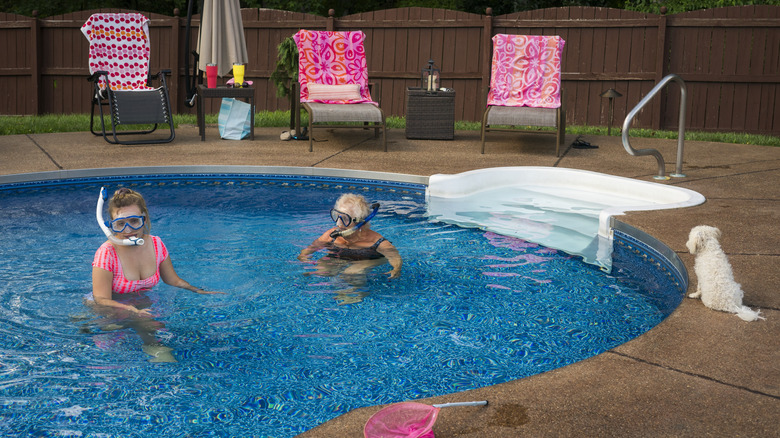 Women snorkeling in a pool