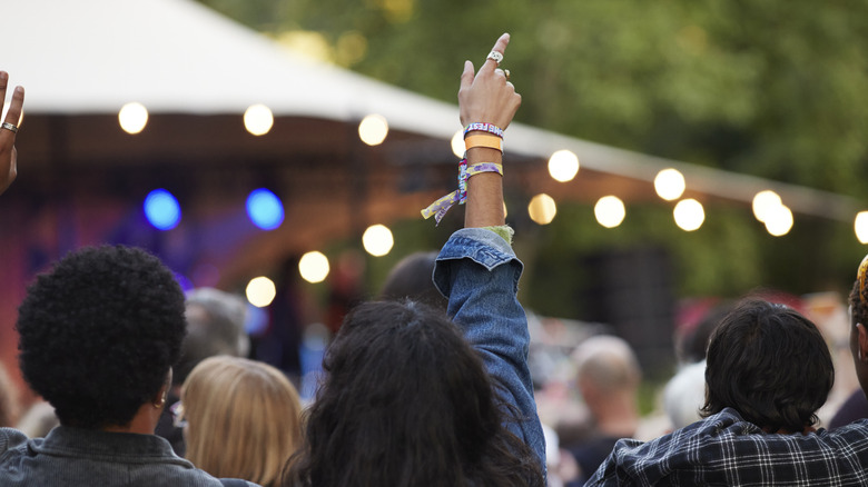 People watching live music at an outside venue
