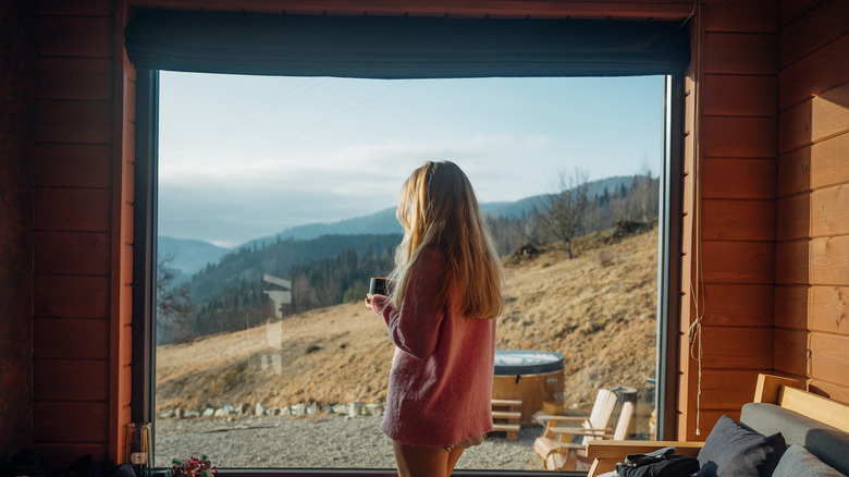 Female traveler soaking up the view from cabin