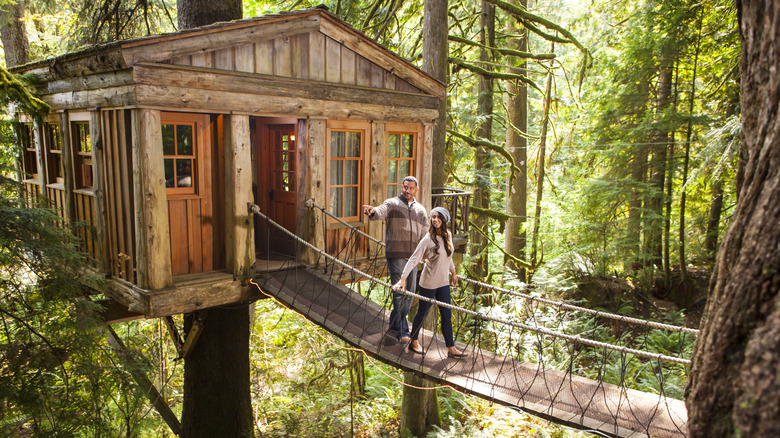 A happy couple on a canopy bridge