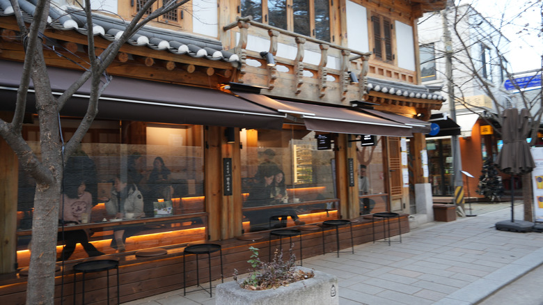 A street cafe in a traditional Korean building.