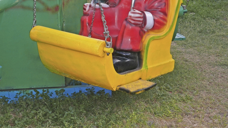 Santa Claus figurines on a swing ride