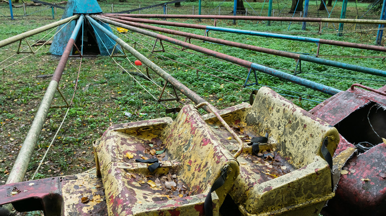 Abandoned and rusty rides at an old theme park
