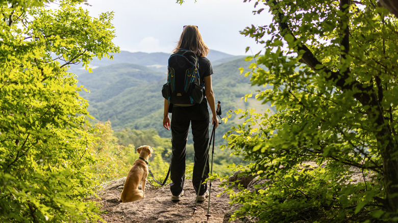 Woman hiking with her dog