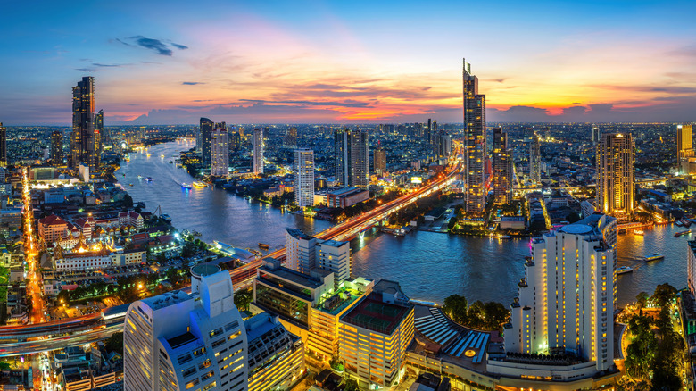 The city of Bangkok by the river at night