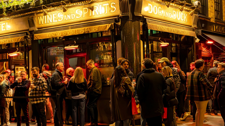 People crowded outside a typical London gastropub