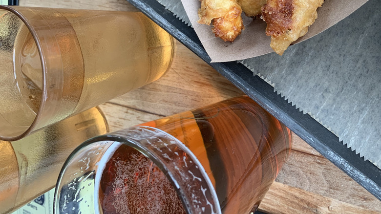 Cheese curds and beer on a table