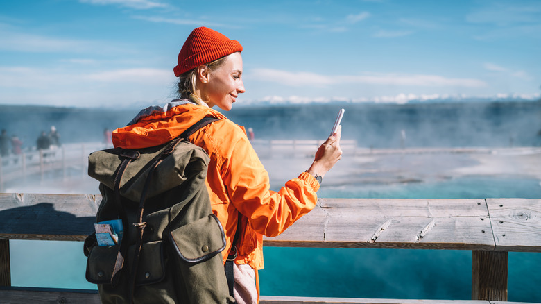 traveler selfie at yellowstone hot spring