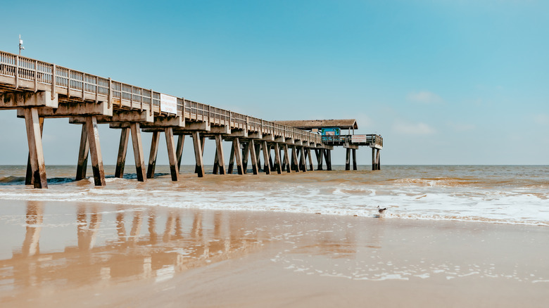 A pier at a beach during a clear day