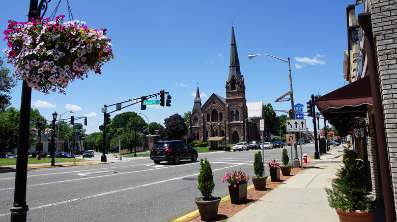 Cars driving past church in downtown Caldwell
