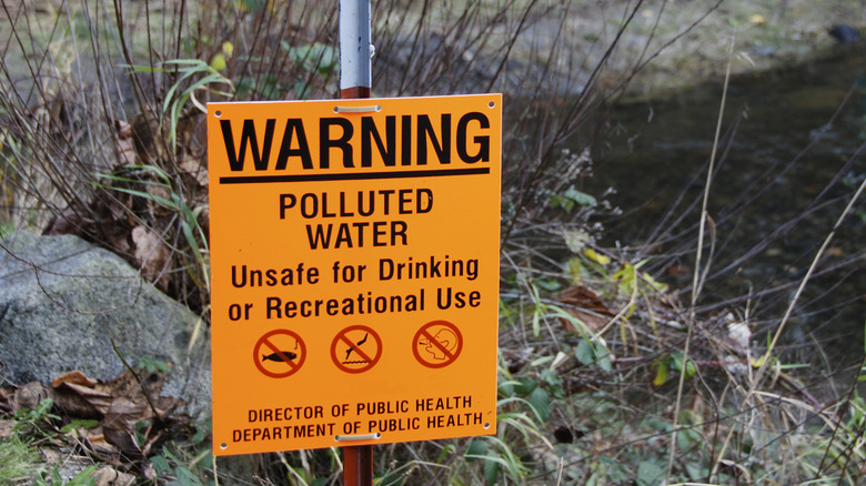 A polluted water warning sign