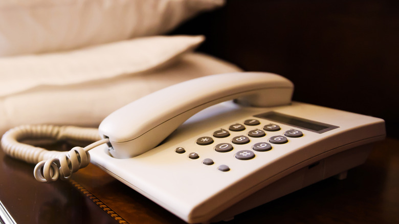 Hotel room with bedside telephone