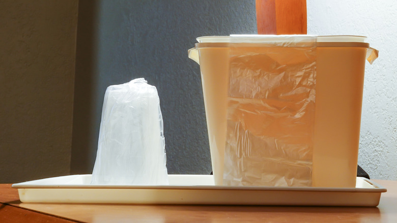 Plastic ice bucket in hotel room