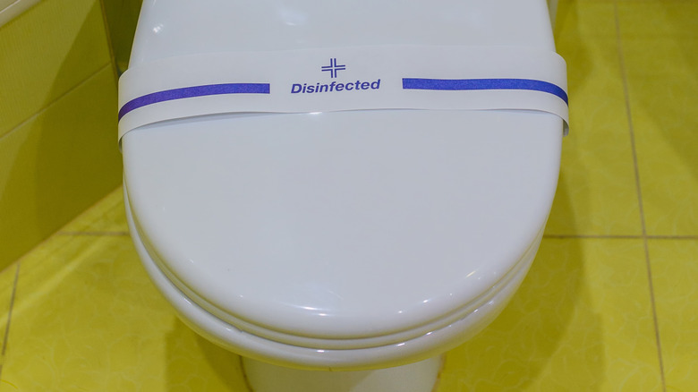 Disinfected hotel room toilet seat