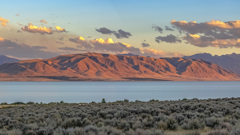 Utah Lake with red mountains in distance