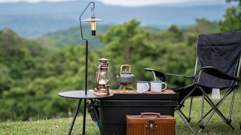 A camping set up with dishes on the table