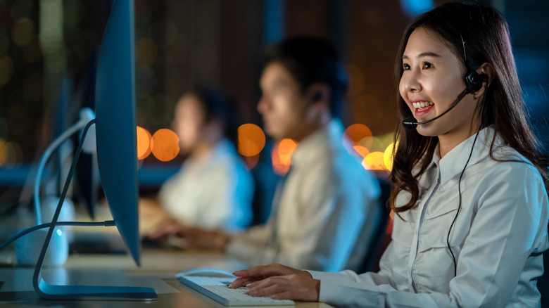 Customer service agent on a call wearing a headset at their desk