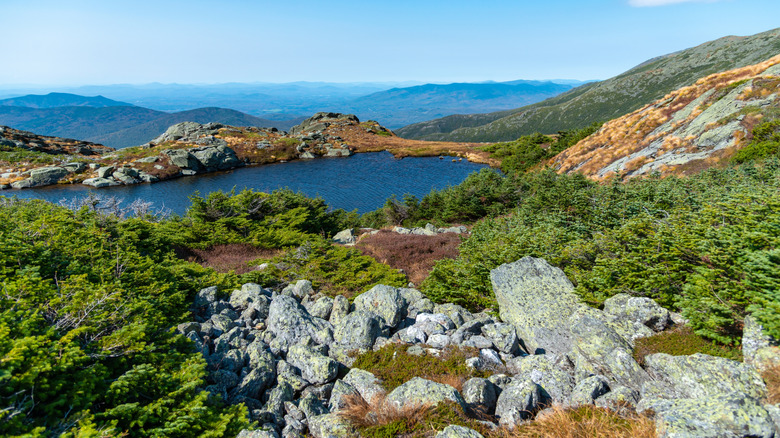 Lakes of the Clouds surrounded by rocks and mountains viewed from the Ammonoosuc Ravine hiking trail