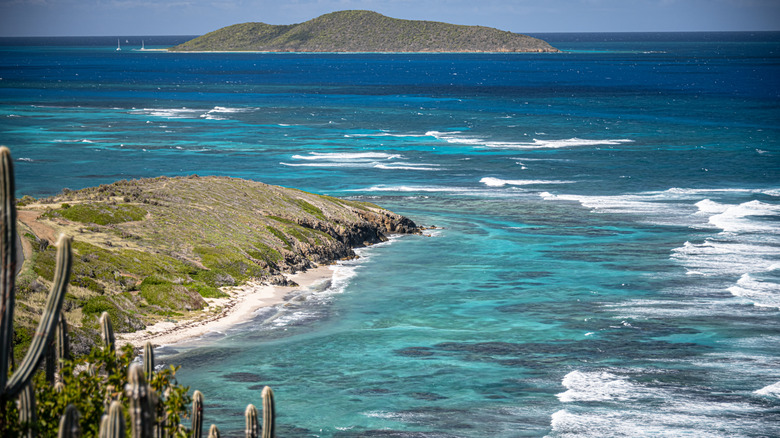 View of the blue water from Point Udall in St. Croix, USVI with with Buck Island in the background