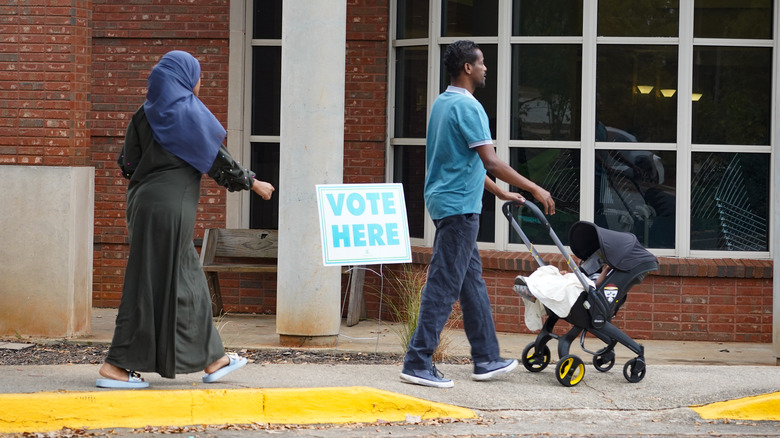 New American voters in Clarkston, Georgia, one pushing a stroller